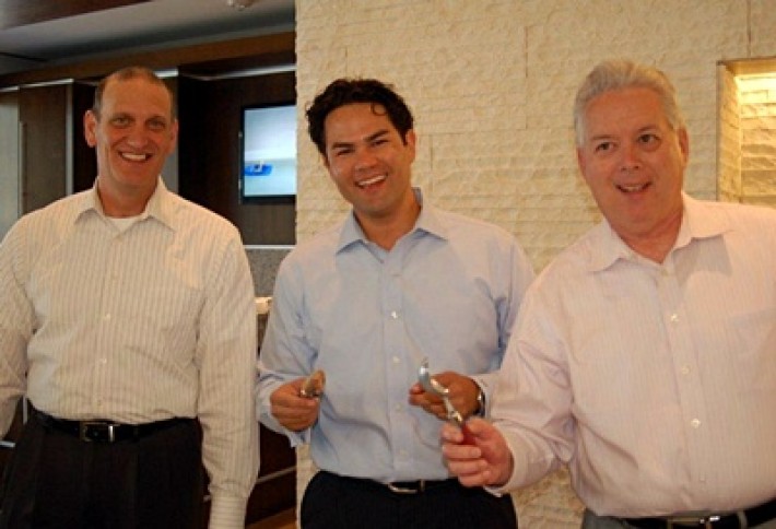 colliers Steve David Pinsel and Ralph Valliere serving ice cream